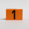 An orange 2x3 LEGO Tile photographed on a white background, with the number 1 printed in black.