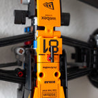 Close-up of an orange and black McLaren LEGO F1 car, showing the number 81 and sponsor logos
